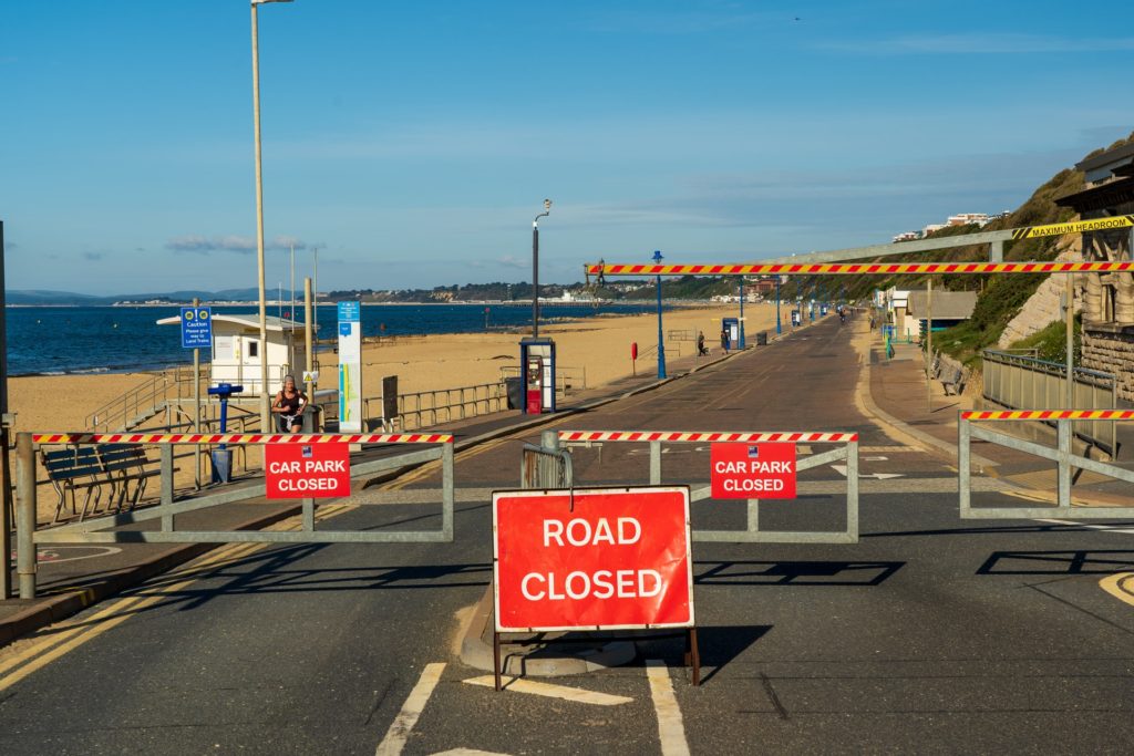 Stretch of road being blocked by barriers, metaphor for overcoming career barriers