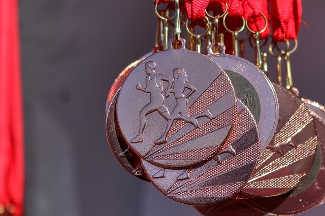 A photograph of multiple medals for running achievements