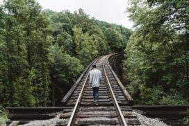 Person walking on train tracks, career exploration brainstorm