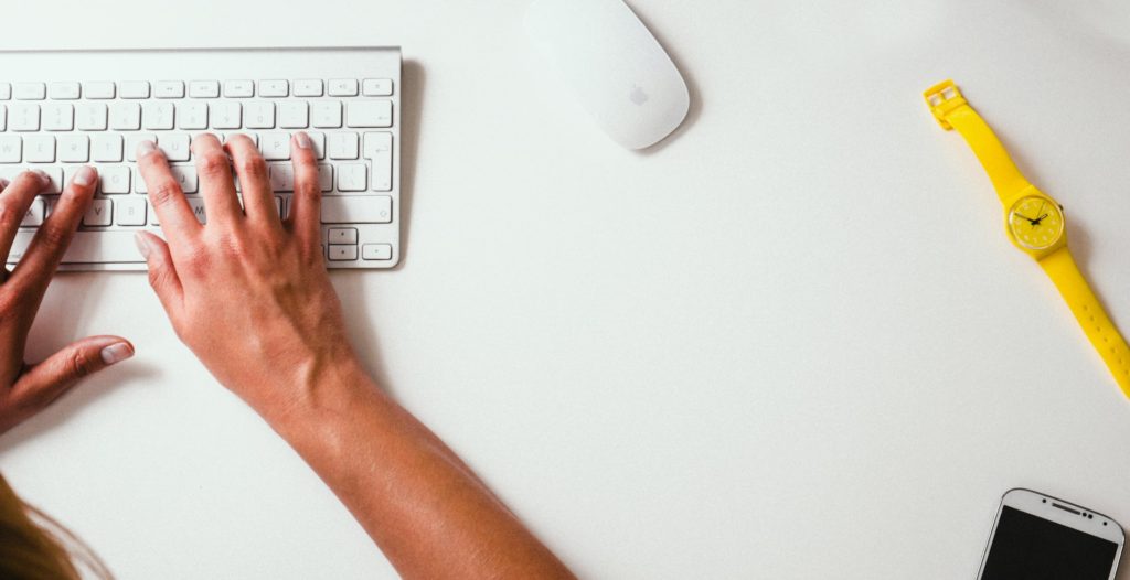 Hands on keyboard on top of desk, job search over 50