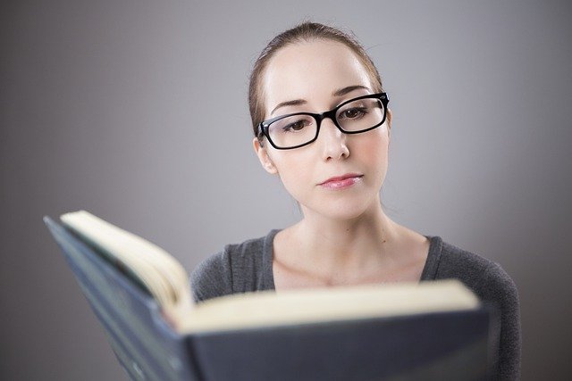 photo of a woman reading a book