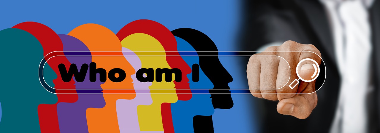 illustration of colorful faces in silhouette with the words "who am I?" and a person pressing an internet search button