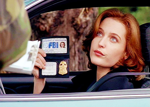 Agent Scully from TV show the X Files showing her FBI badge