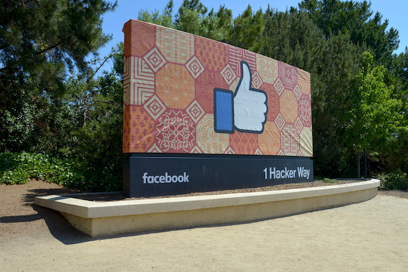 the facebook company headquarters sign showing the thumbs up "like" emoticon