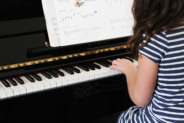 a kid practicing piano