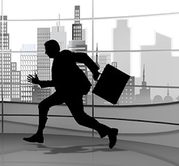 silhouette of a businessman escaping with a briefcase