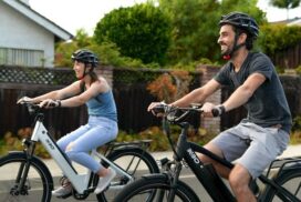 Two people riding bikes