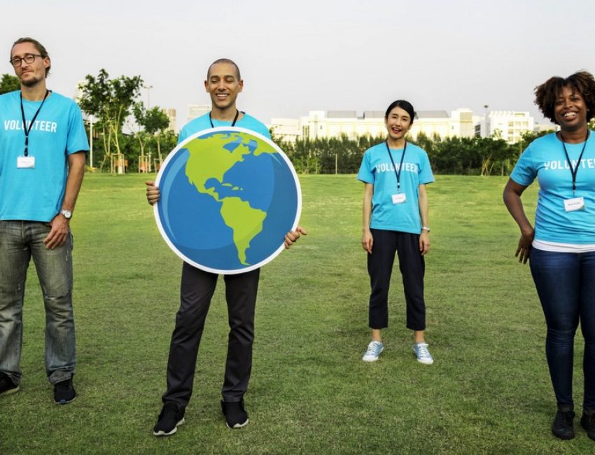 a group pose of environmental activist volunteers